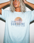 Woman wearing Edit Inc. Chasing Sunshine graphic tee in Chambray.